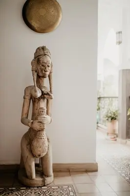 a statue of a woman standing in a room at Riad Alnadine in Marrakech