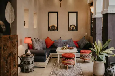 a living room with a couch and a table at Riad Alnadine in Marrakech