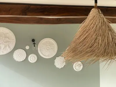 a bunch of plates are hanging on a wall at Chimera Apartments & Suites in Marrakech