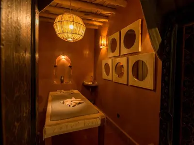 a room with a table and a chandelier at CASA ABRACADABRA in Marrakech