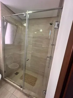 a shower with a glass door in a bathroom at Comme a la maison Prestigia Golf acces piscine in Marrakech