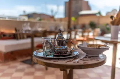 a table with a tea kettle and a bowl on it at Riad Babouchta & Spa in Marrakech