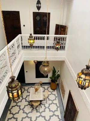 an overhead view of a room with tables and chandeliers at Riad Babouchta & Spa in Marrakech