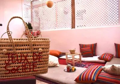 a living room with a couch and a basket at COSY LUXURY Apartment - GUELIZ in Marrakech