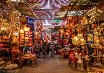 a group of people walking through a shop in a market at COSY LUXURY Apartment - GUELIZ in Marrakech