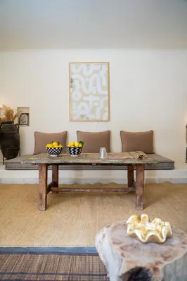 a coffee table in a living room with a couch at MORO Marrakech Boutique Hôtel in Marrakech