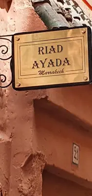 a sign on the side of a building at Riad Ayada in Marrakech
