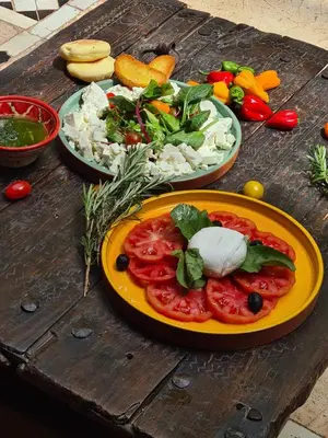 a table with plates of food on a wooden table at DAR CHIBANIA in Marrakech