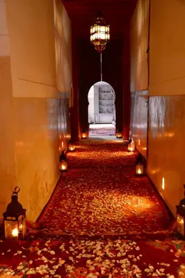 an empty hallway with a large amount of leaves on the floor at DAR CHIBANIA in Marrakech