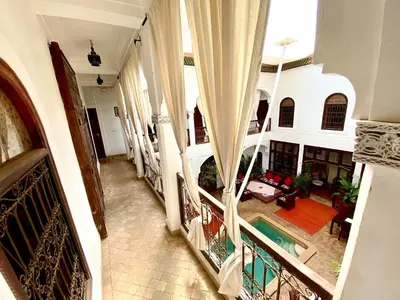 an aerial view of a house with a swimming pool at Riad Mandalay in Marrakech