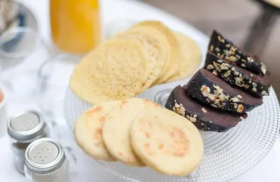 a plate of food with chocolate dessert and slices of bread at Riad Houma in Marrakech