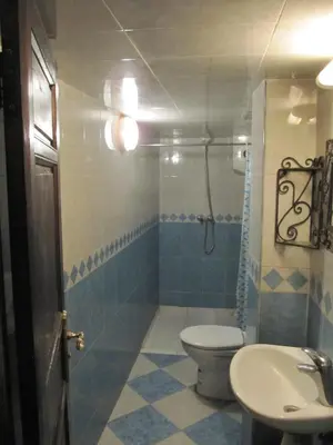a bathroom with a toilet and a sink at Sindi Sud in Marrakech