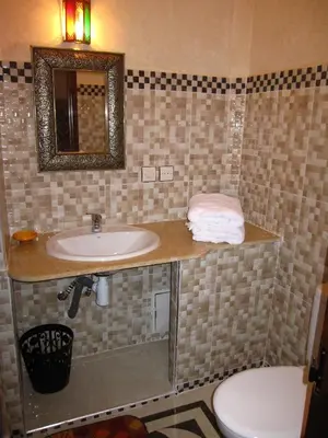 a bathroom with a sink and a toilet at Sindi Sud in Marrakech