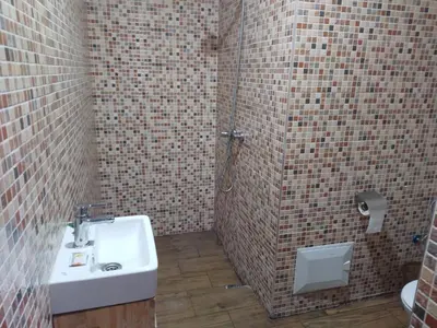 a bathroom with a sink and a toilet at Hôtel Agnaou in Marrakech