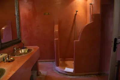 a bathroom with a shower and a sink at RIAD KERDOUSS in Marrakech