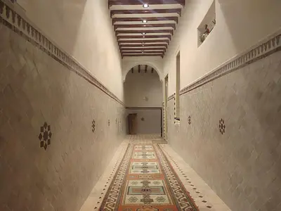 an empty hallway with a rug on the floor at house miss rose in Marrakech