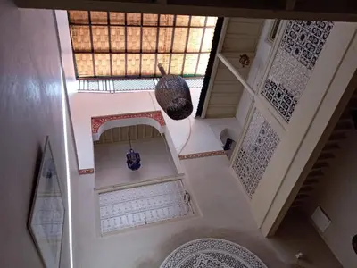 an overhead view of a staircase in a house at house miss rose in Marrakech