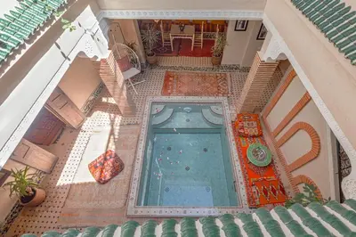 an overhead view of a swimming pool in a building at Riad Salman in Marrakech