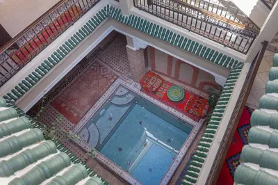 an overhead view of a swimming pool in a building at Riad Salman in Marrakech