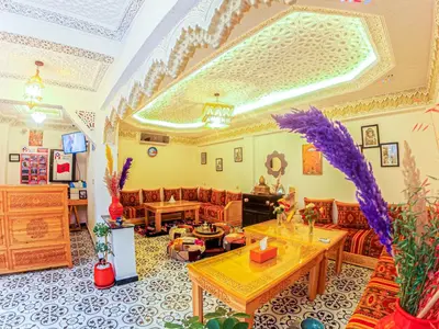 a living room with a couch and a table at Riad Dar Yassine in Marrakech
