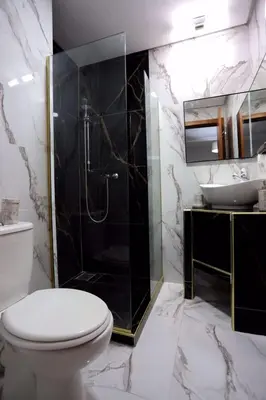 a bathroom with a toilet and a shower and a sink at Prestigia Golf City Marrakech in Marrakech