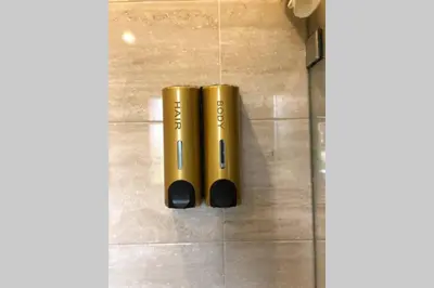 two gold cylinders are sitting on the floor at Cosy Loft Emeraude Marrakech Prestigia Golf City in Marrakech