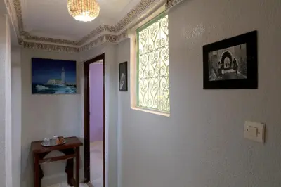 a room with a window and a hallway at Riad el Boukhiri in Marrakech