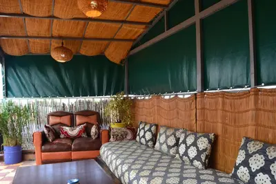 a living room with a couch and a chair at Riad el Boukhiri in Marrakech