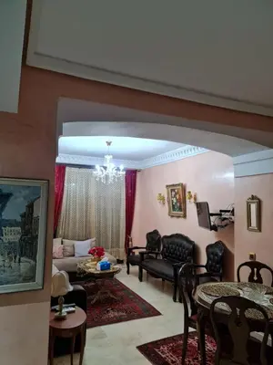 a living room with a chandelier at Luxury apartment in the heart of Gueliz , Wifi, Pool in Marrakech