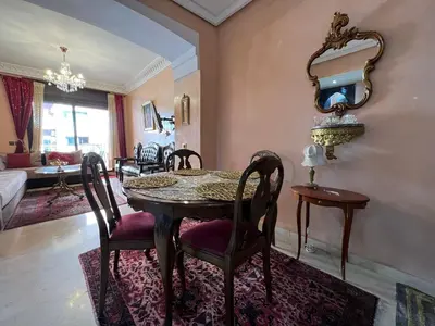a dining room with a table and chairs at Luxury apartment in the heart of Gueliz , Wifi, Pool in Marrakech