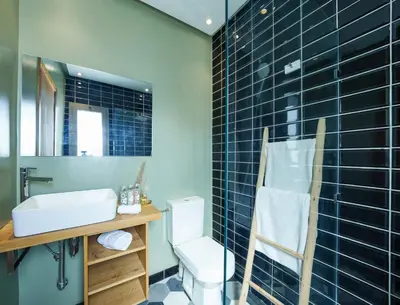 a bathroom with a toilet and a sink and a mirror at dar al walidine in Marrakech