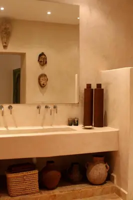 a bathroom with a sink and a mirror at Riad Timila in Marrakech