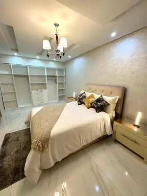 a bedroom with a large bed in a room at Duplex Sabah Opera - Quartier Hivernage in Marrakech