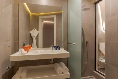 a bathroom with a sink and a shower at Pestana CR7 Marrakech in Marrakech