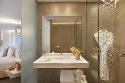 a bathroom with a sink and a shower at Pestana CR7 Marrakech in Marrakech