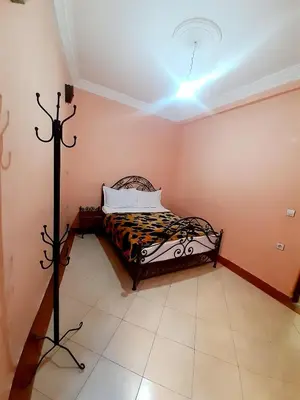 a bedroom with a bed in a room at Hotel salem leksor in Marrakech