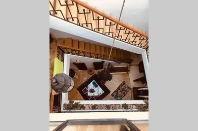 a room with a staircase with a mirror at Riad Touareg in Marrakech