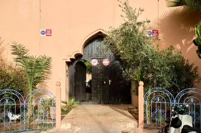 a black door in the side of a building at Riad AMBER ZAHRA in Marrakech