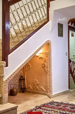 a staircase in a house with a stair case at Riad AMBER ZAHRA in Marrakech