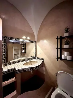 a bathroom with a sink and a mirror at Riad Green Palm in Marrakech
