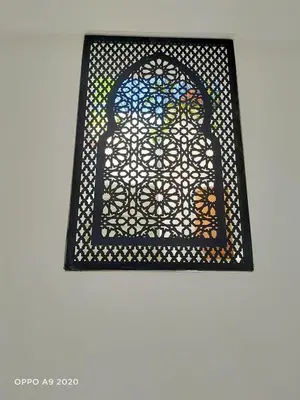 a stained glass window in a room at Riad Olika in Marrakech