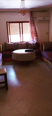 a living room with a couch and a table at Twins 13 in Marrakech