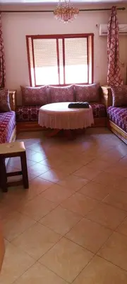 a living room with two couches and a table at Twins 13 in Marrakech
