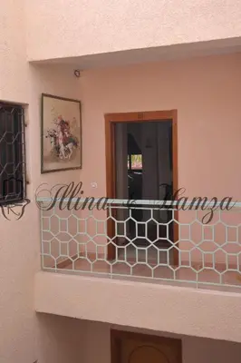 a balcony of a house with a fence at Illina & Hamza Apartment in Marrakech