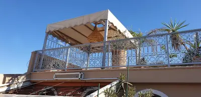 a balcony of a building with plants on it at Riad Souad Marrakech in Marrakech