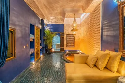 a living room with a couch and a tub at Riad Yamina52 in Marrakech