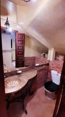 a bathroom with a sink and a toilet at Riad Prestigia in Marrakech