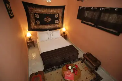 an overhead view of a bedroom with a bed and a table at Riad white flowers in Marrakech
