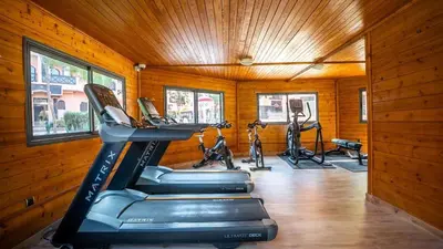 a gym with treadmills and exercise bikes in it at Appartement aux portes de la palmeraie in Marrakech
