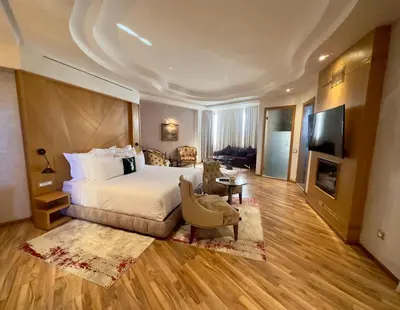 a hotel room with a bed and a television at Sillage Palace Sky & Spa in Marrakech